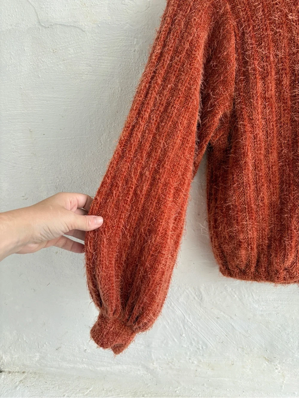 orange fuzzy balloon-sleeve sweater from Altar'd State